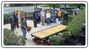A restored antique baggage cart was unveiled at Bedford Depot Park on May 19, 2014.