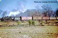 The "BB Local" freight train is making its northbound journey through Billerica on February 23, 1953.